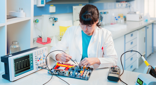 A person working on a pcb