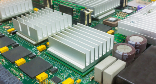 Board with large SMT heat sinks