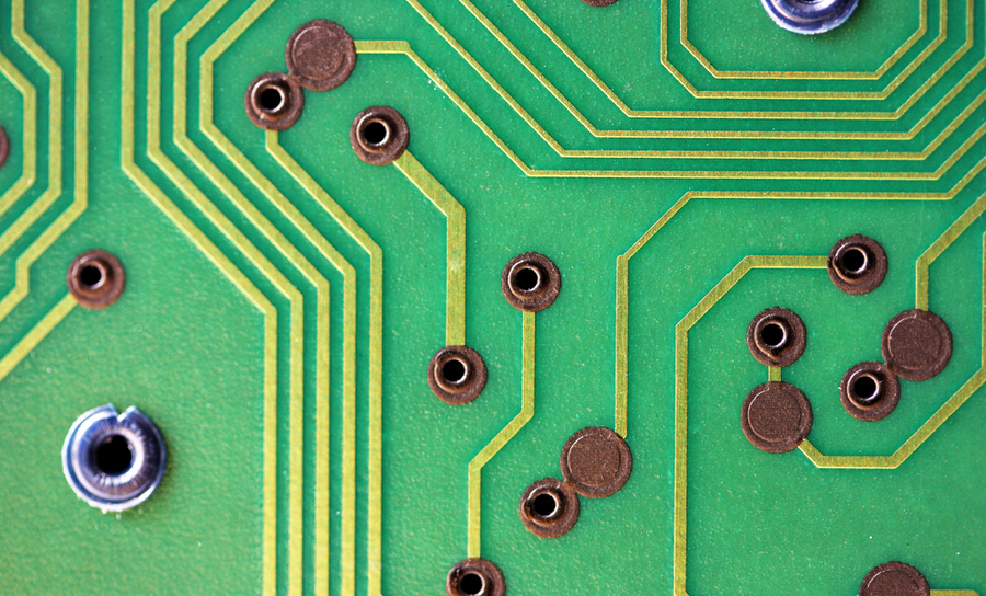 Close-up of circuit board with vias