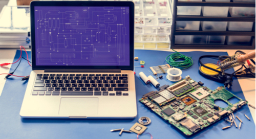 Circuit board routing on a CAD tool next to a printed circuit