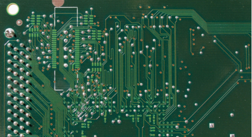 Intricate routing on a green PCB