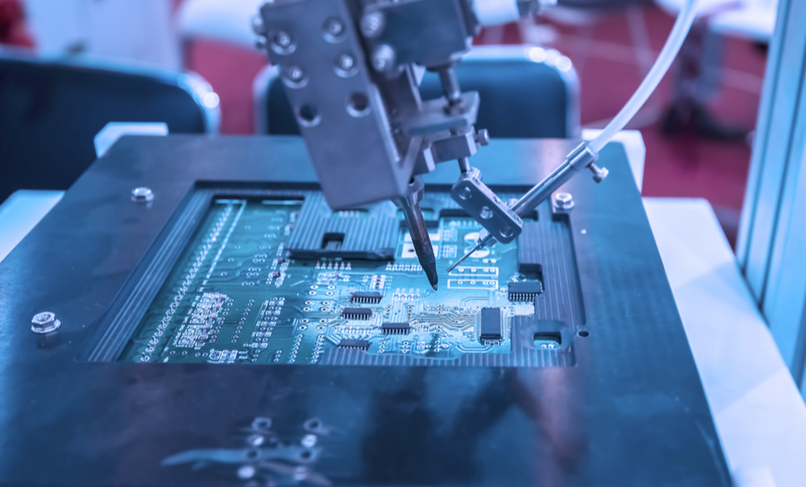  Automated machine soldering components on a PCB