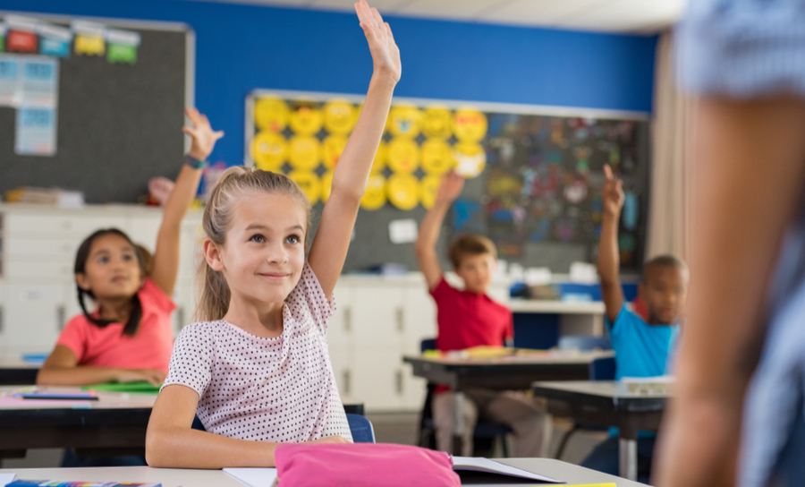 students raising their hands