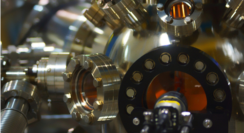 Thermal deposition of conformal coatings in a vacuum chamber